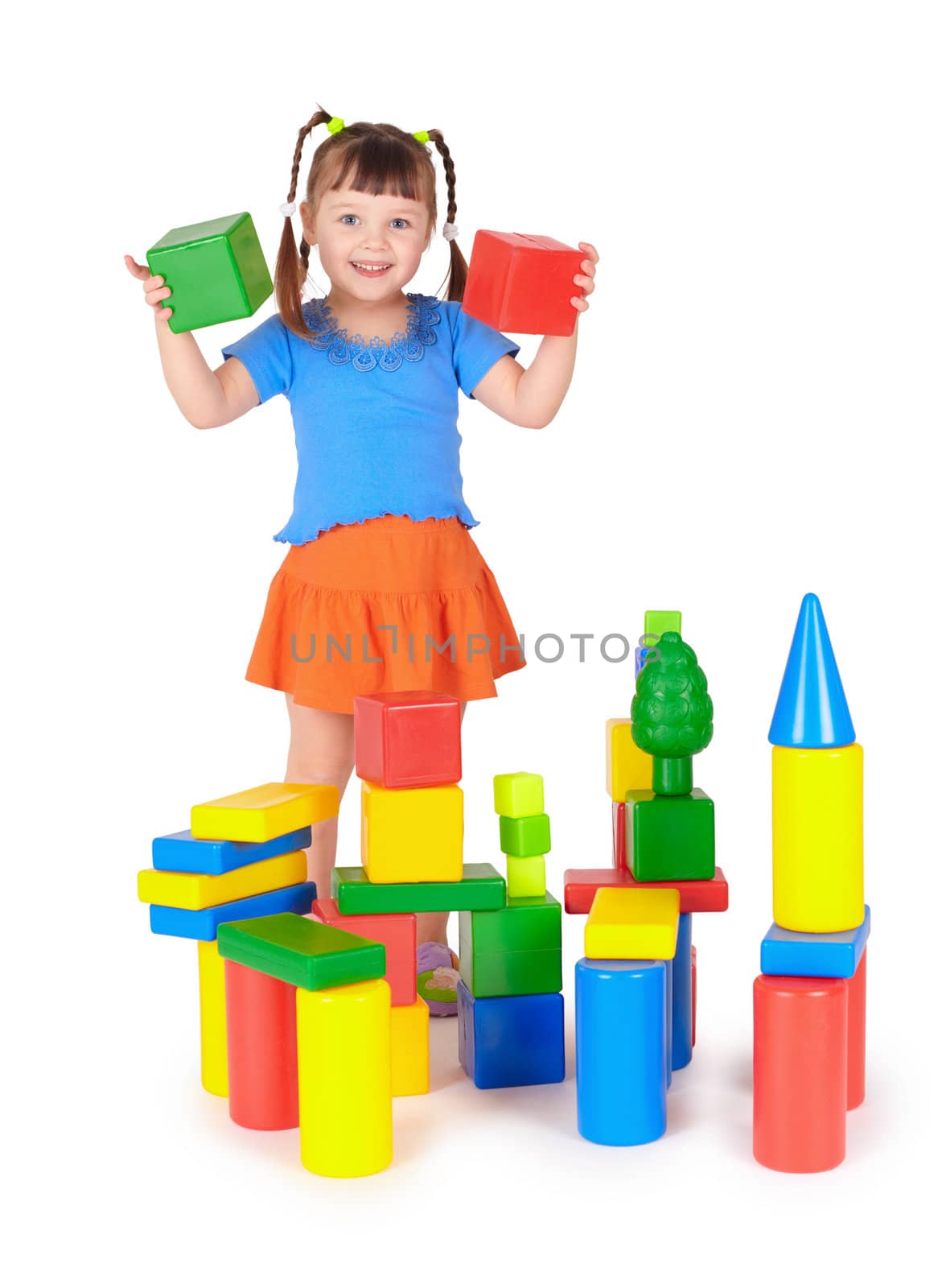The little girl is playing with colored blocks