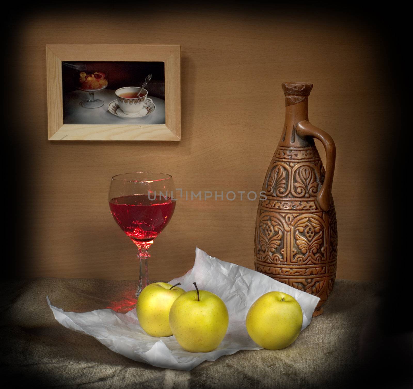 Still-life with a glass of wine and apples