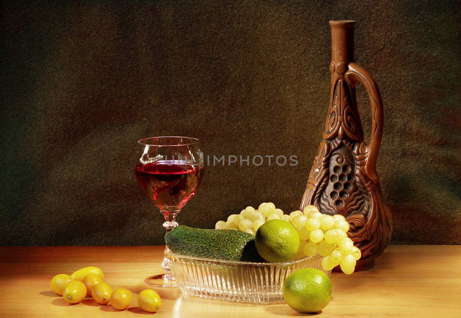 Still-life with kumquat, lime and avocado