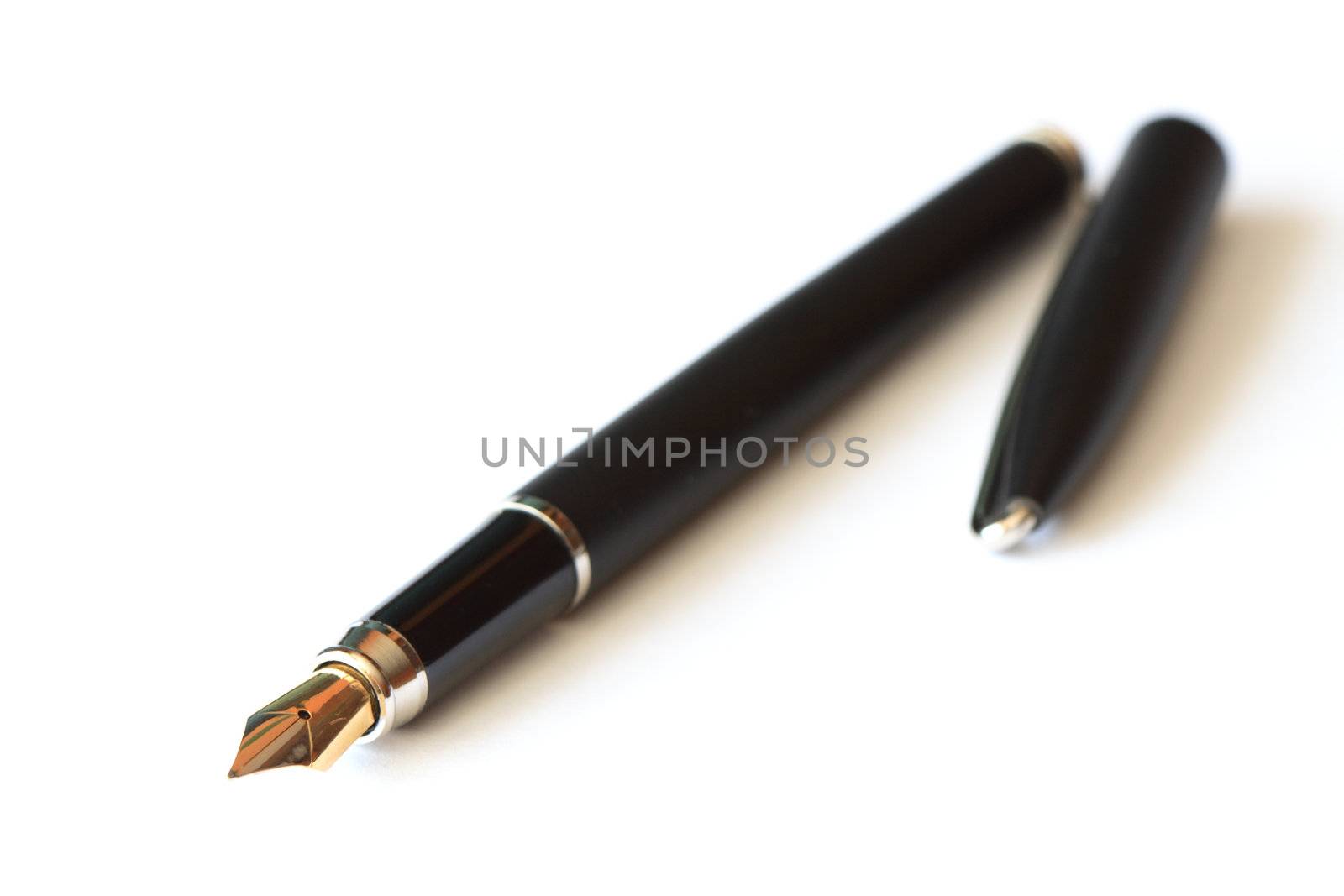 Nice black fountain pen lying on white background