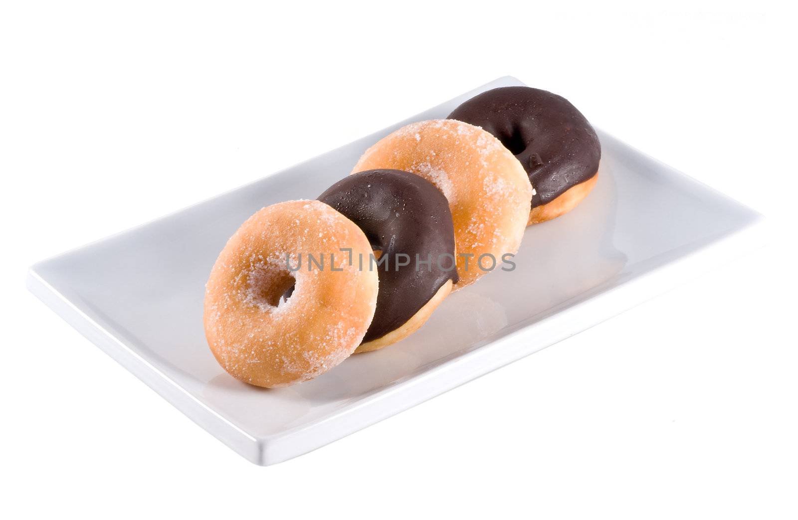Fresh donuts on a white square plate, isolated on a white background