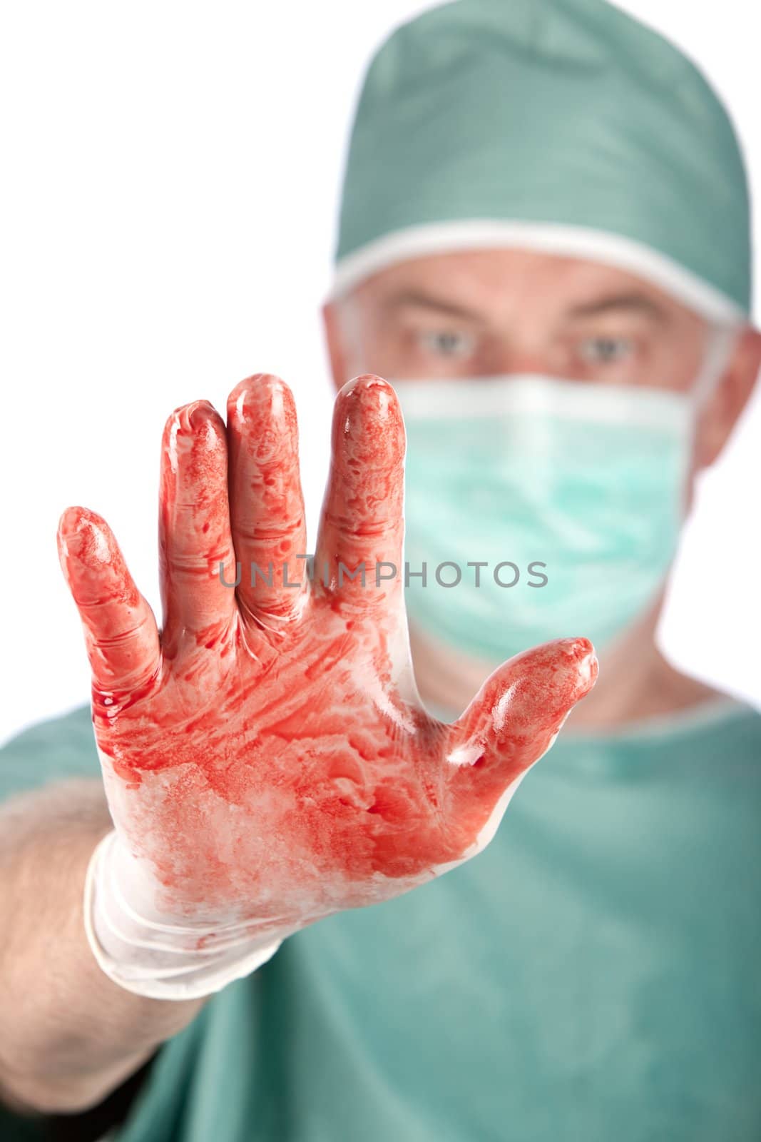 A 60 year old surgeon with bloody hands on a white background.