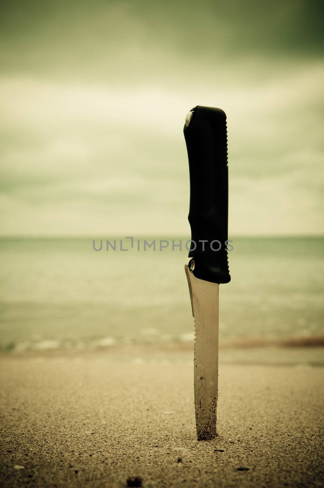 Knife in sand by Erchog