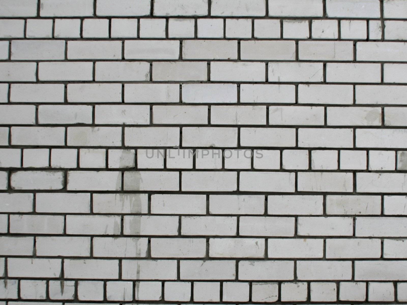 Old brick wall of white color