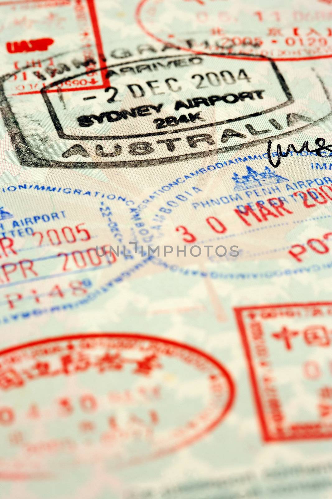 Macro / selective focus image of passport stamps.  Focus is on the word Australia.
