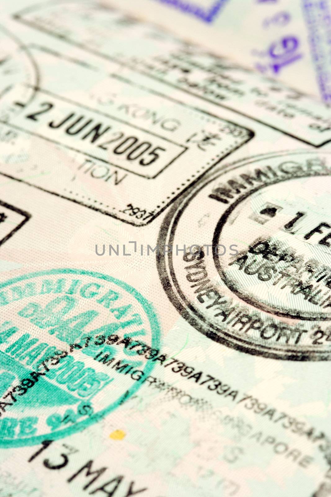 Macro / selective focus image of passport stamps.  Focus is in the middle.
