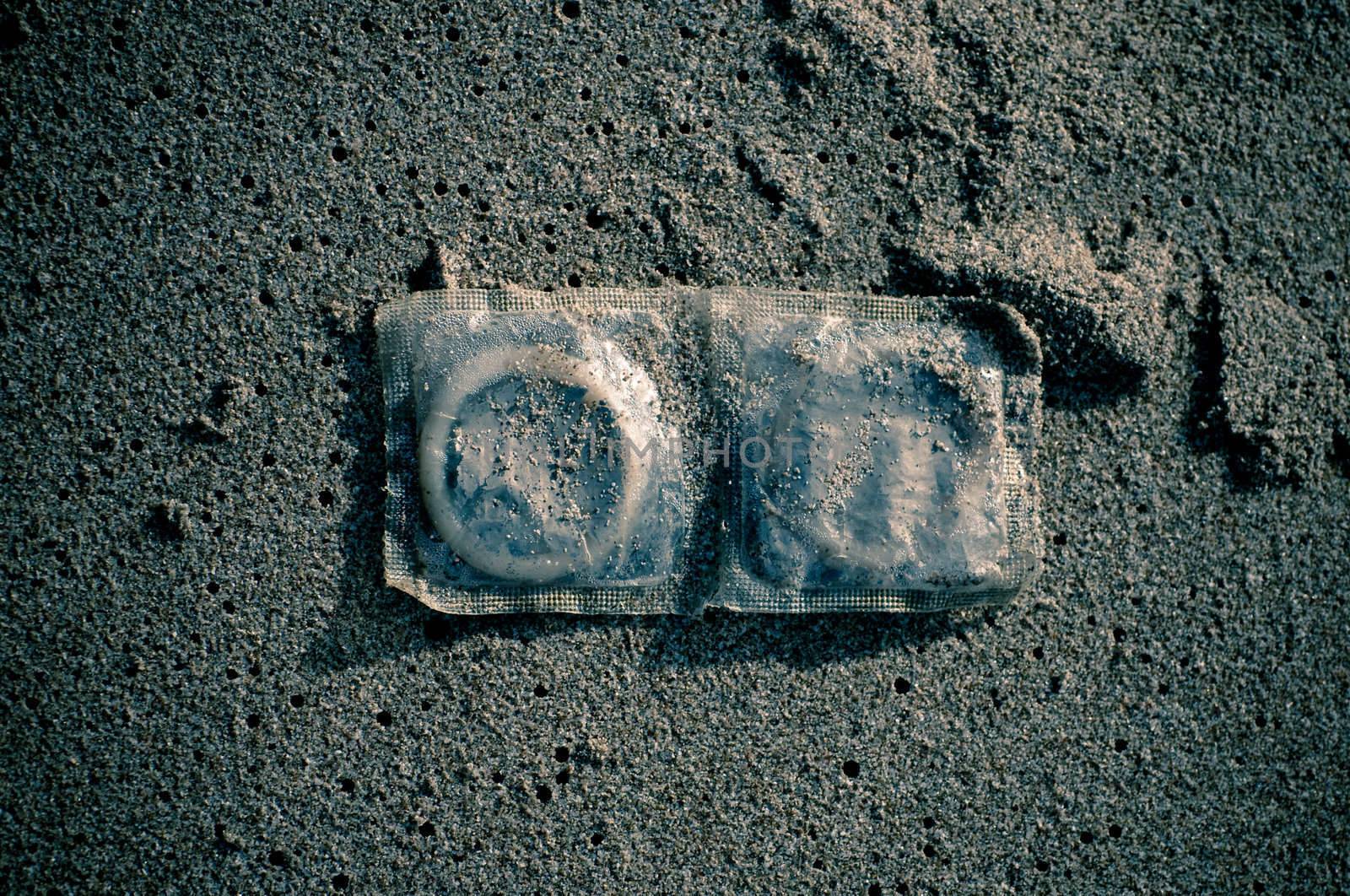 Condoms in sand