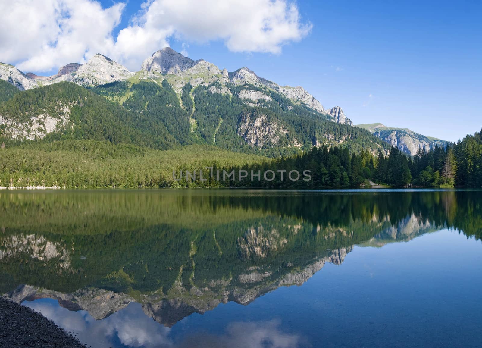 summer view of a beautiful lake in Italian alps