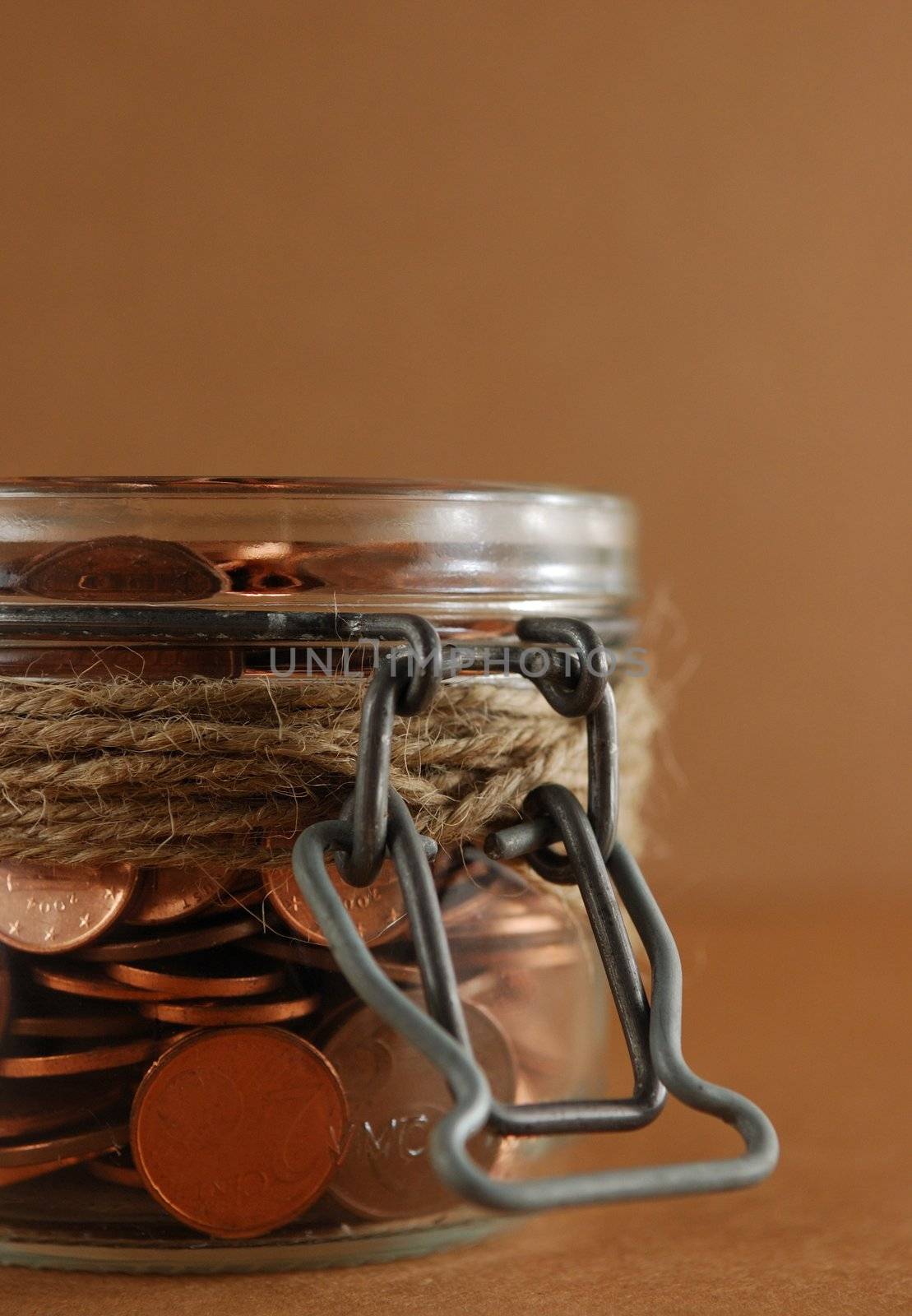 Glass Jar of coins. Savings Concept by maggiemolloy