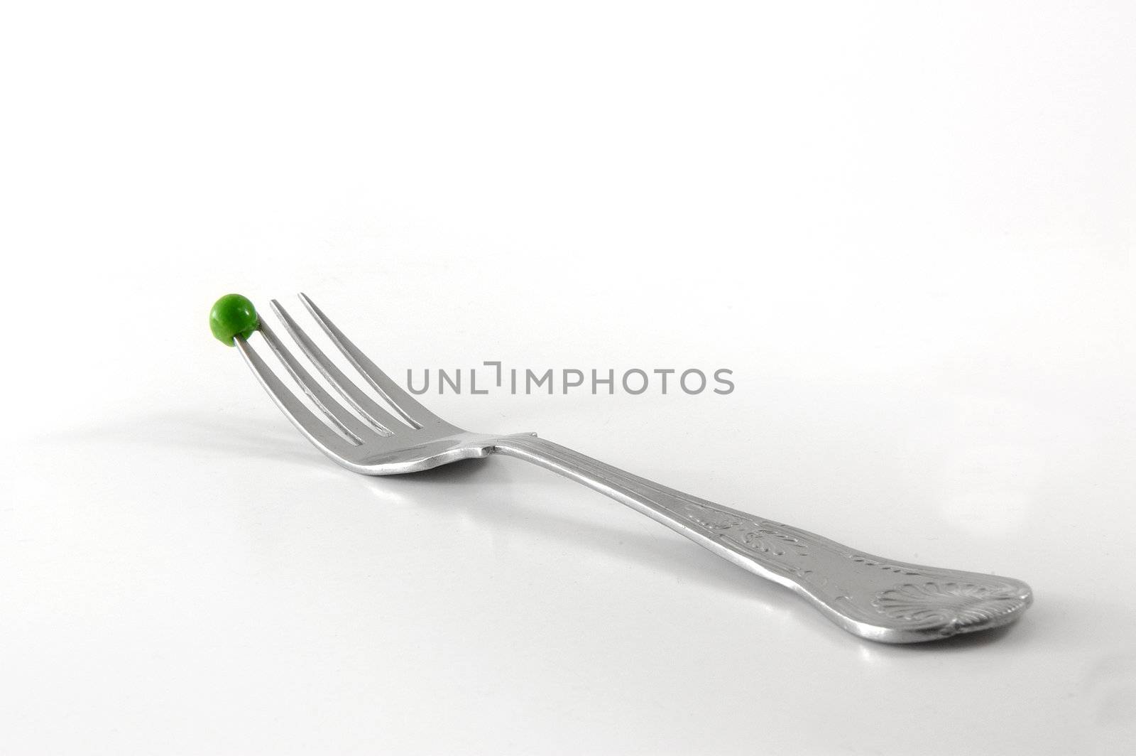 Single pea on fork by maggiemolloy