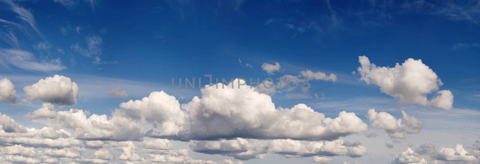 Panorama of the blue cloudy years sky