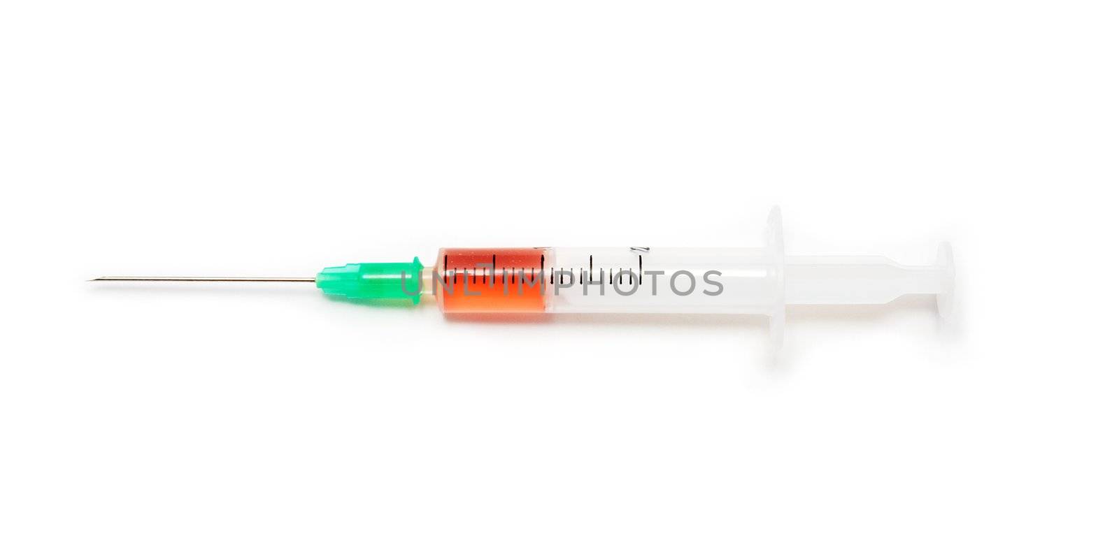 Syringe filled by two milliliters of red liquid substance