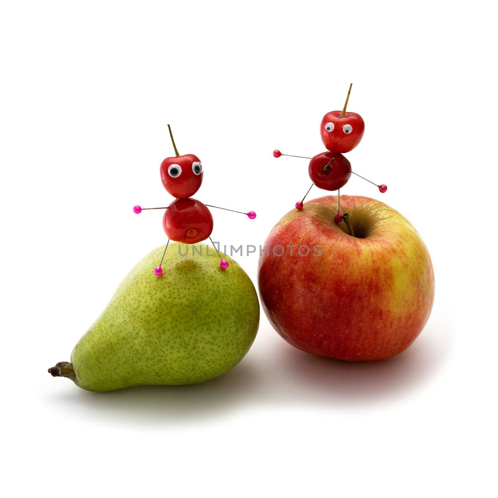 Two cheerful little men from a sweet cherry on fruit