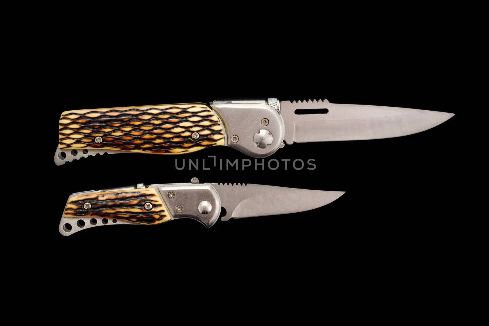Two sharp knifes with beautiful handles on a dark background