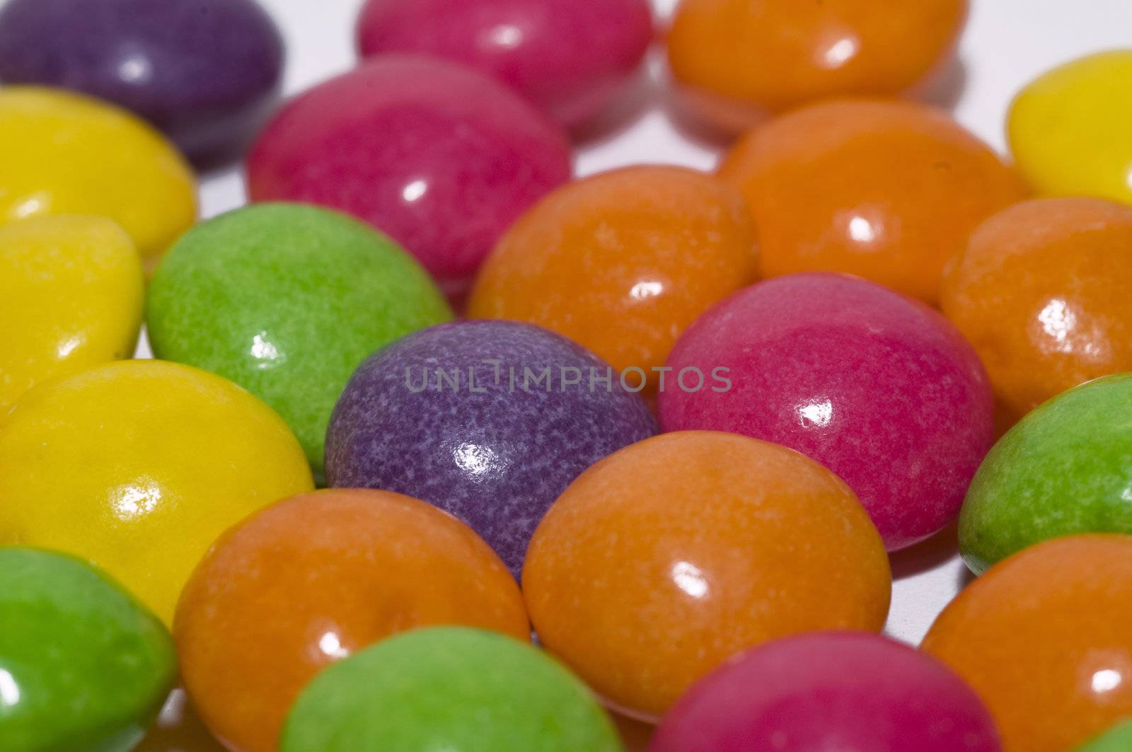 rainbow of round colored candies