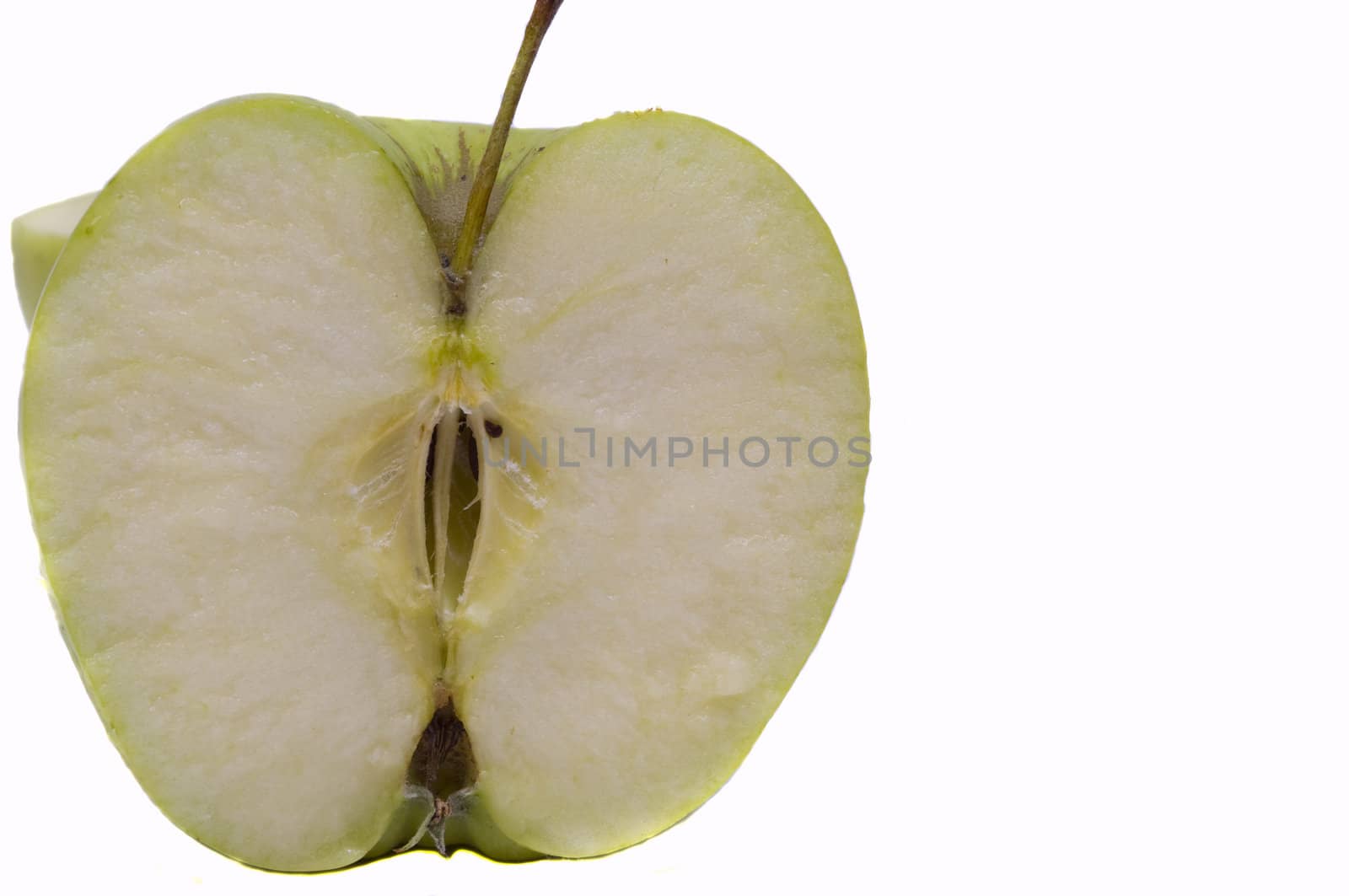 freshly cut green organic apple, isolated on white