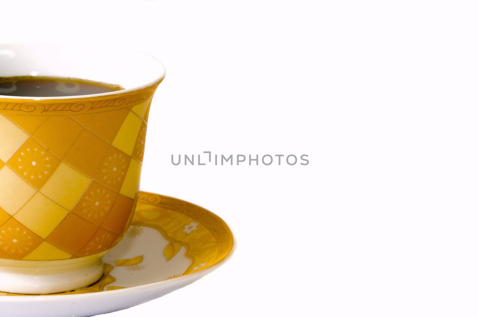 close-up on a gold coffee cup, isolated on white