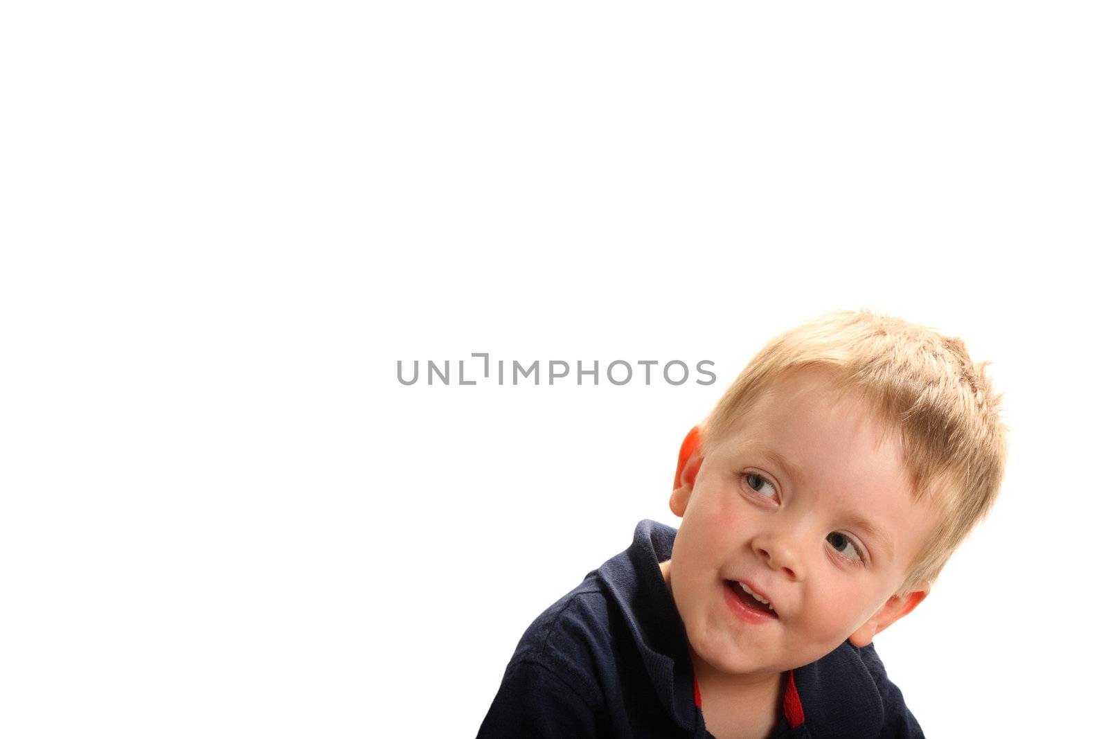 Cute smiling boy with blonde hair and green eyes looking up, isolated on white