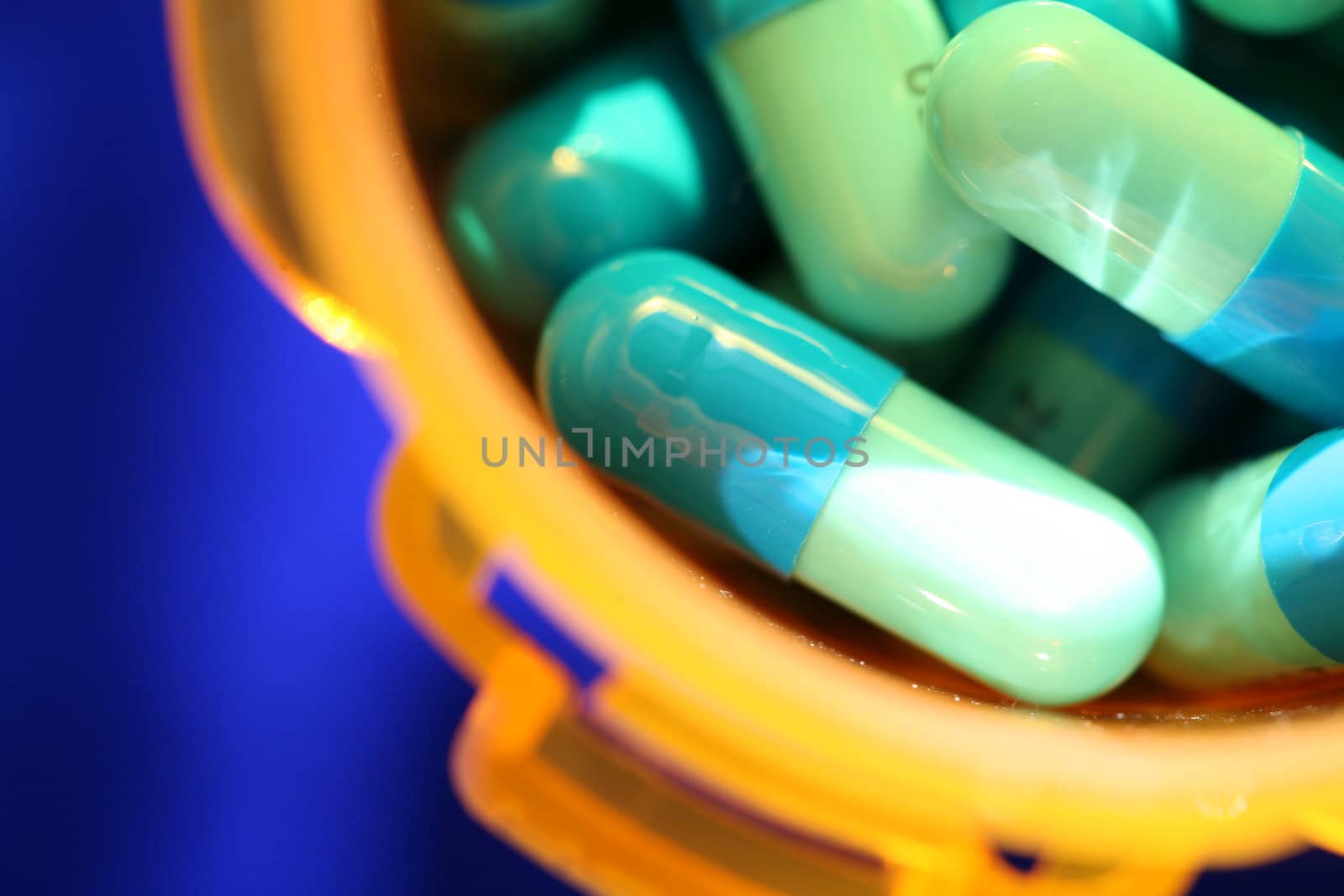 Medicine, pills against blue background by jarenwicklund