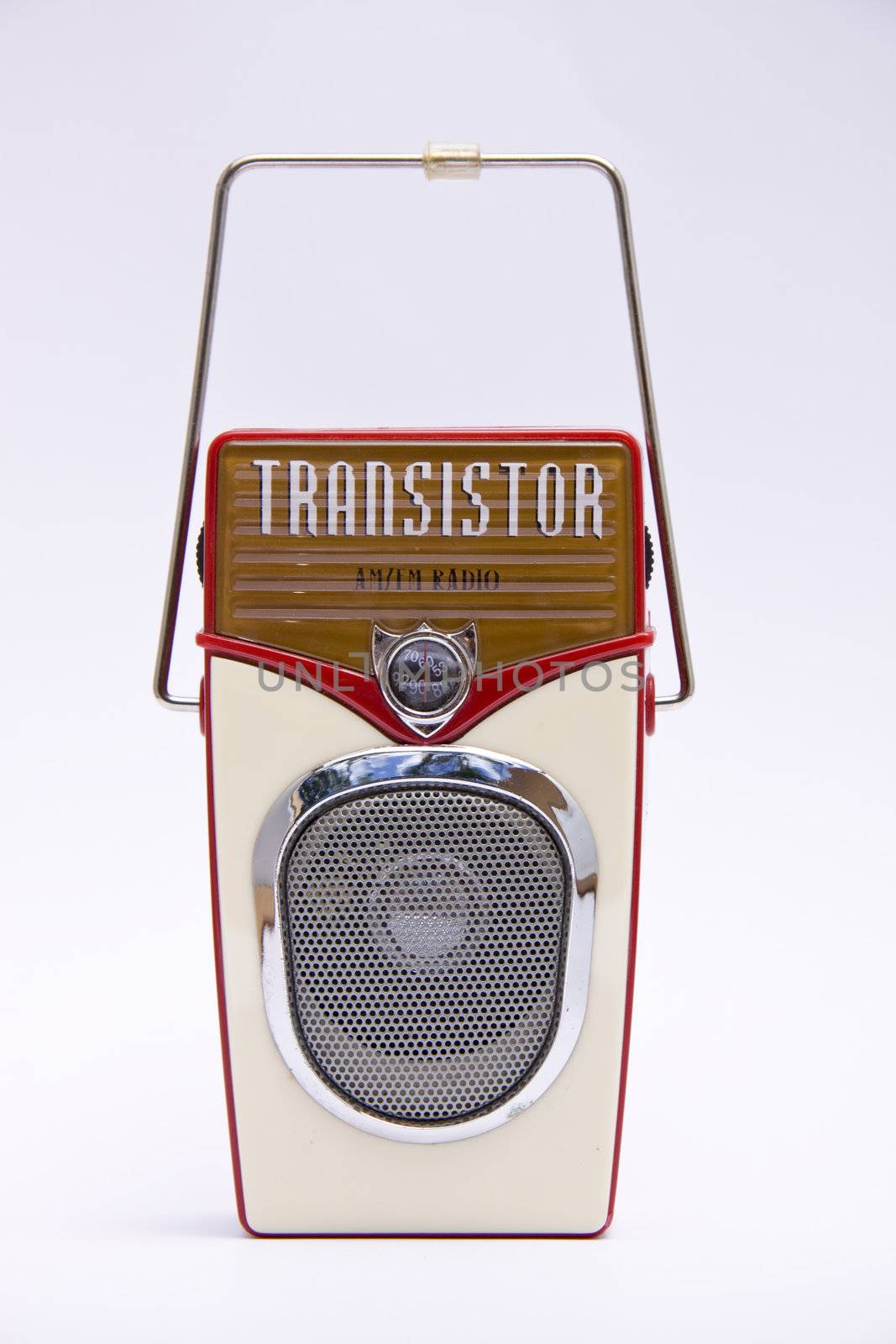 A retro transistor radio isolated over white 