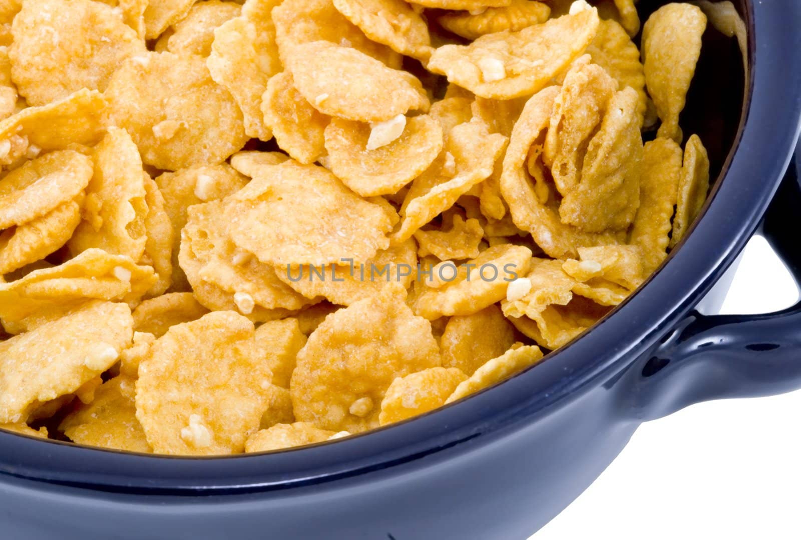 a blue bowl of dry cornflakes - healthy diet