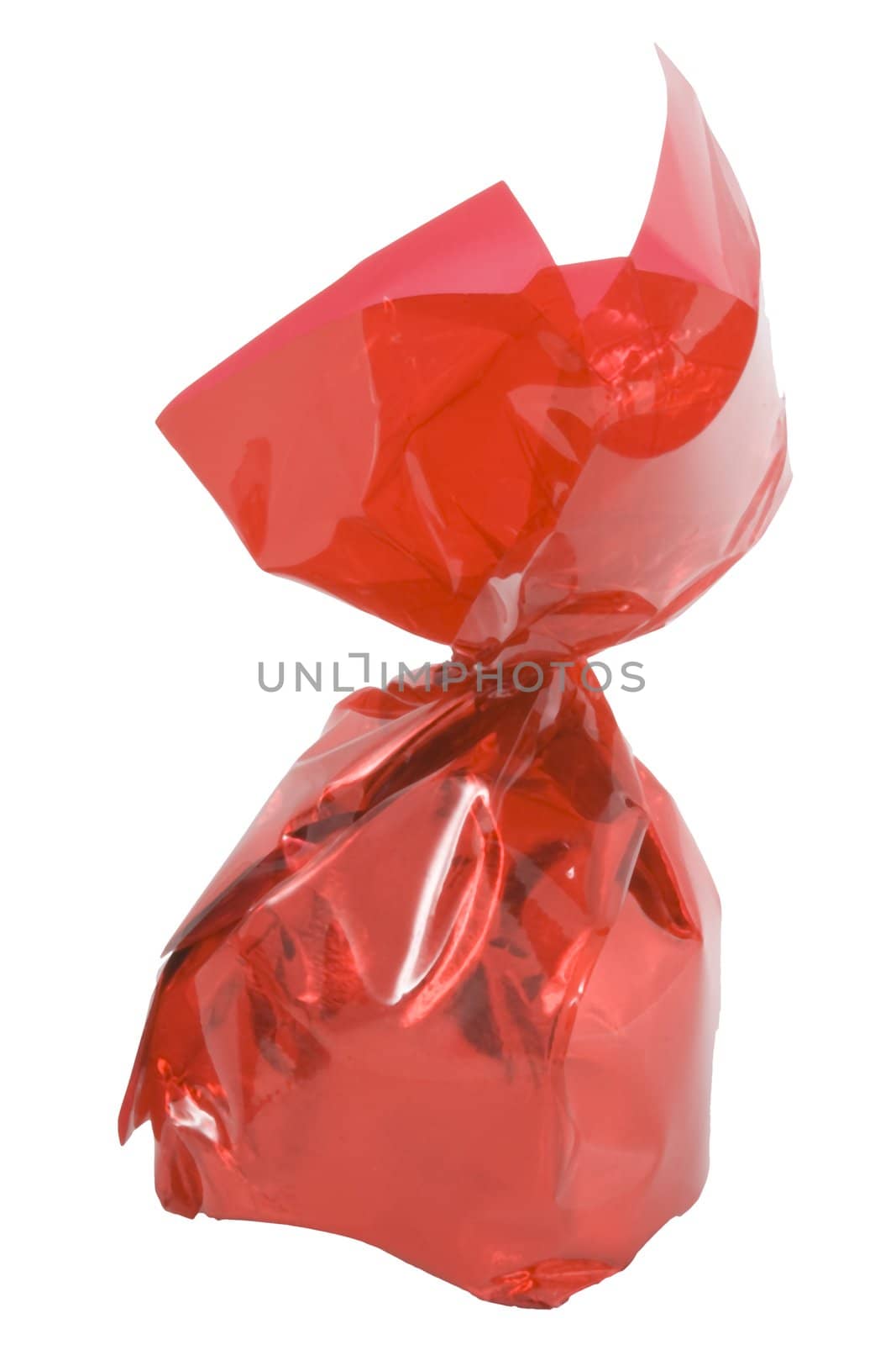 a piece of sweets in a red wrapper - confectionery - close up