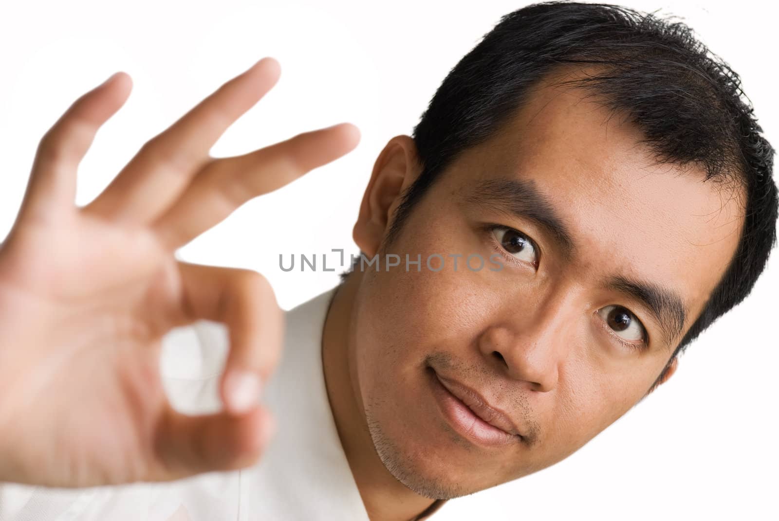 OK showed by business man of Asian on white background.