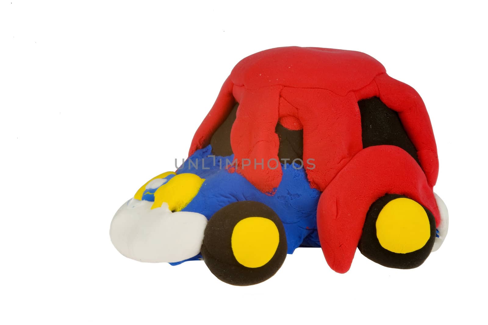 a colorful handmade car, made of clay