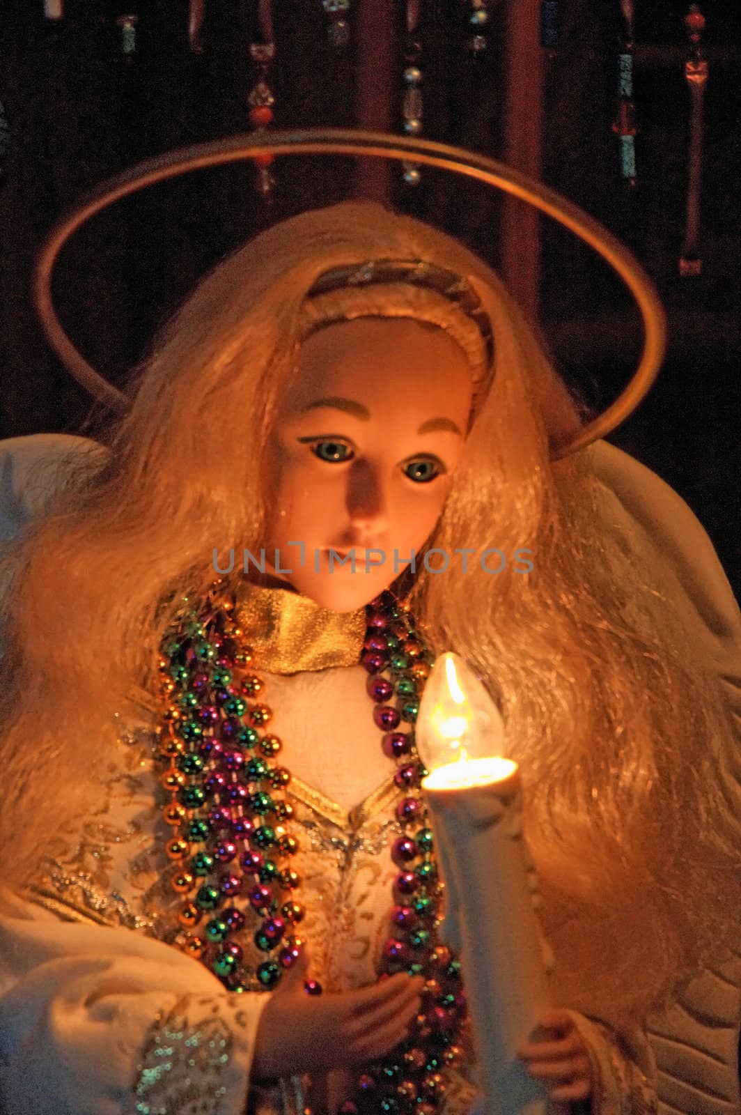 Decorative Christmas angel doll with halo and light.