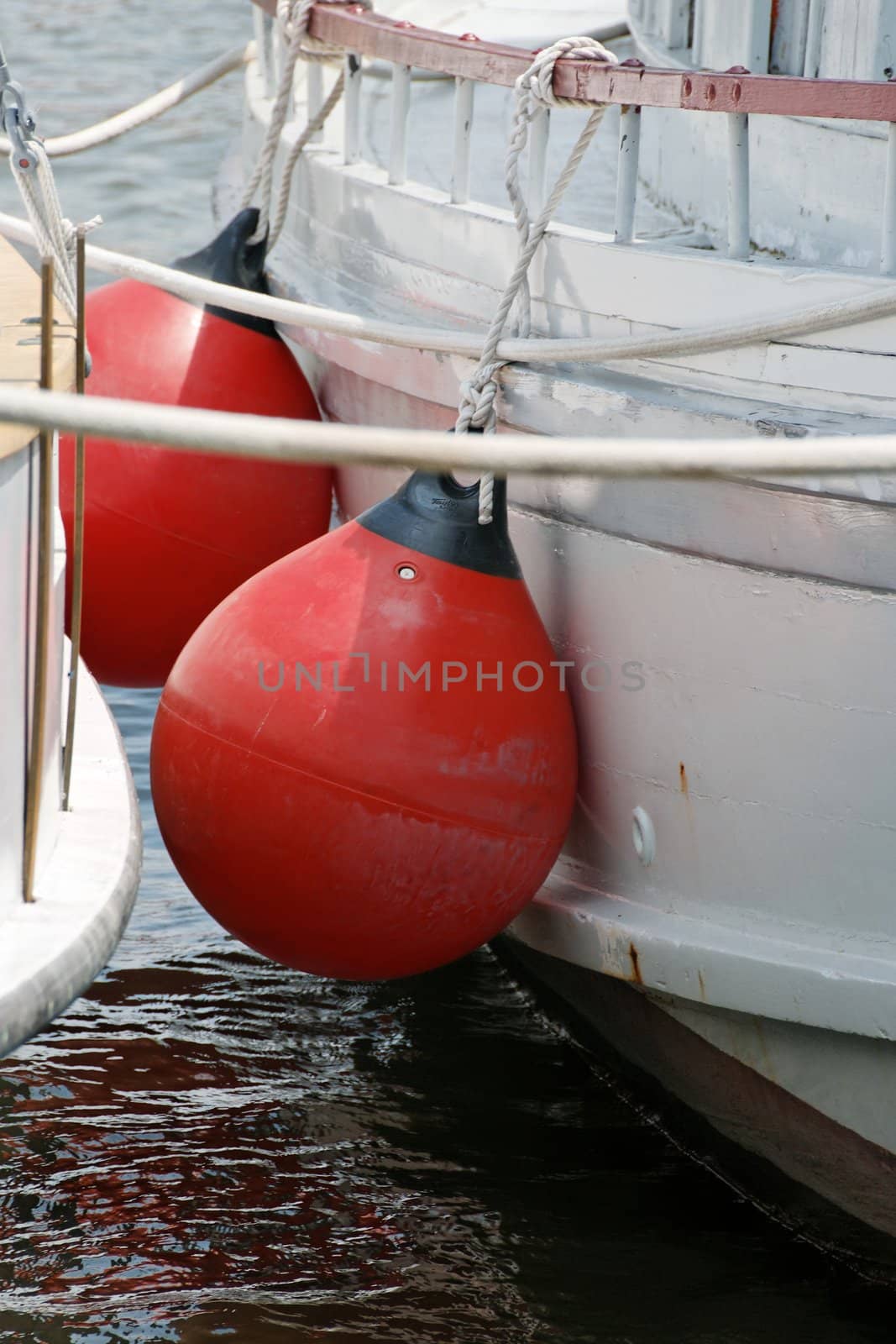 A pair of red boat fenders un use.