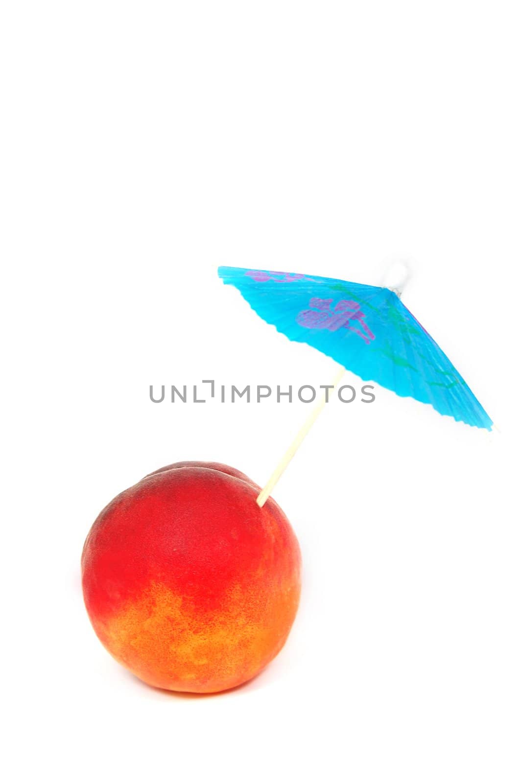Ripe peach with umbrella isolated on white