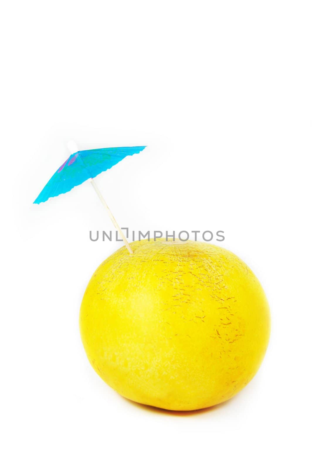 melon with umbrella isolated on white