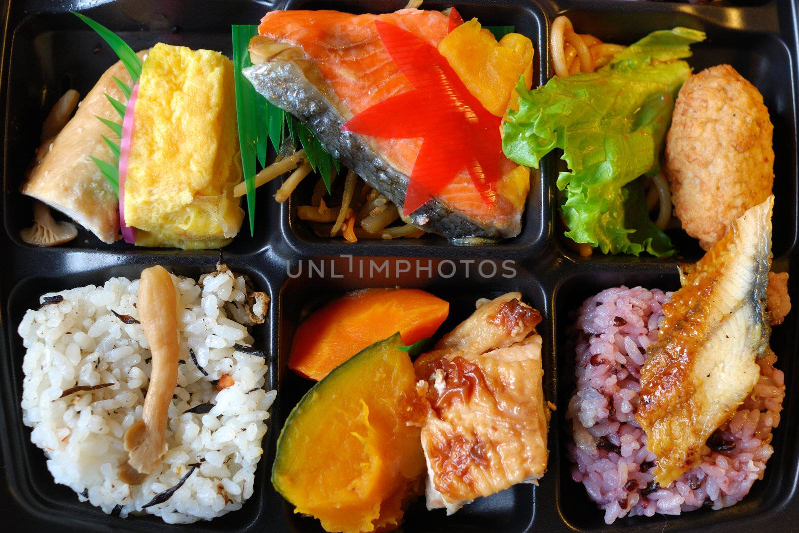  traditional Japanese lunch box, called o-bento with different mixed food 