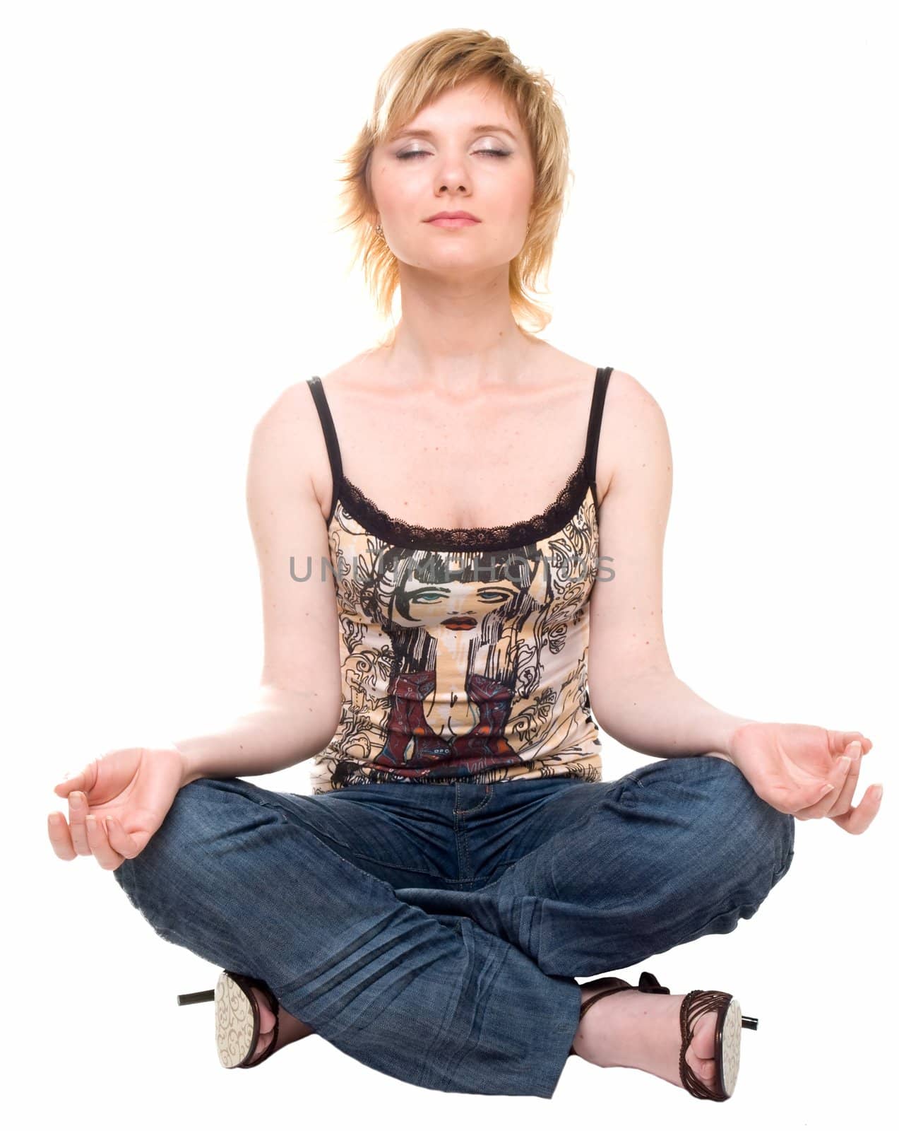 yoga. beautiful girl meditates on a white background