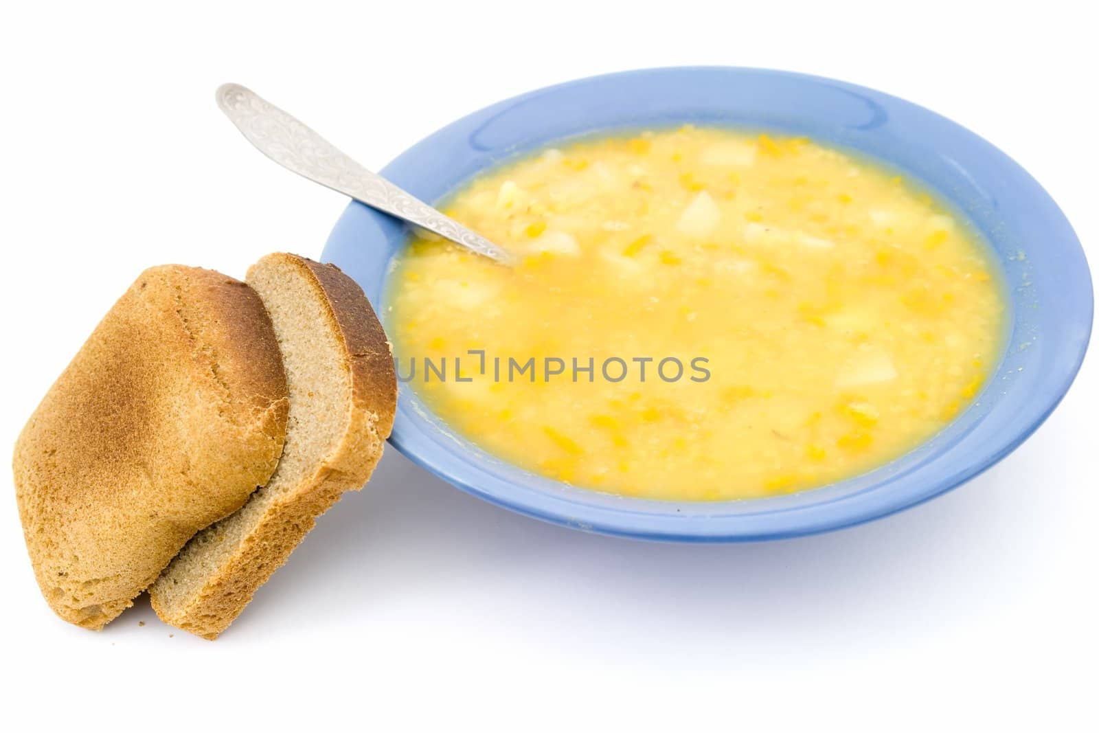 Plate with soup on a white background