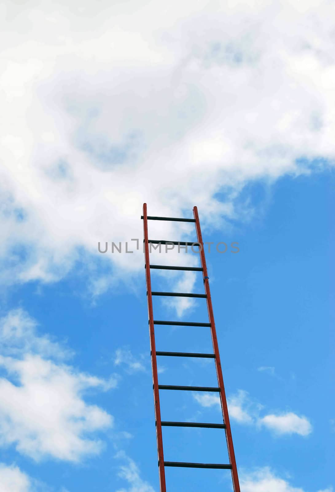 View of builders ladder against cloudy blue sky