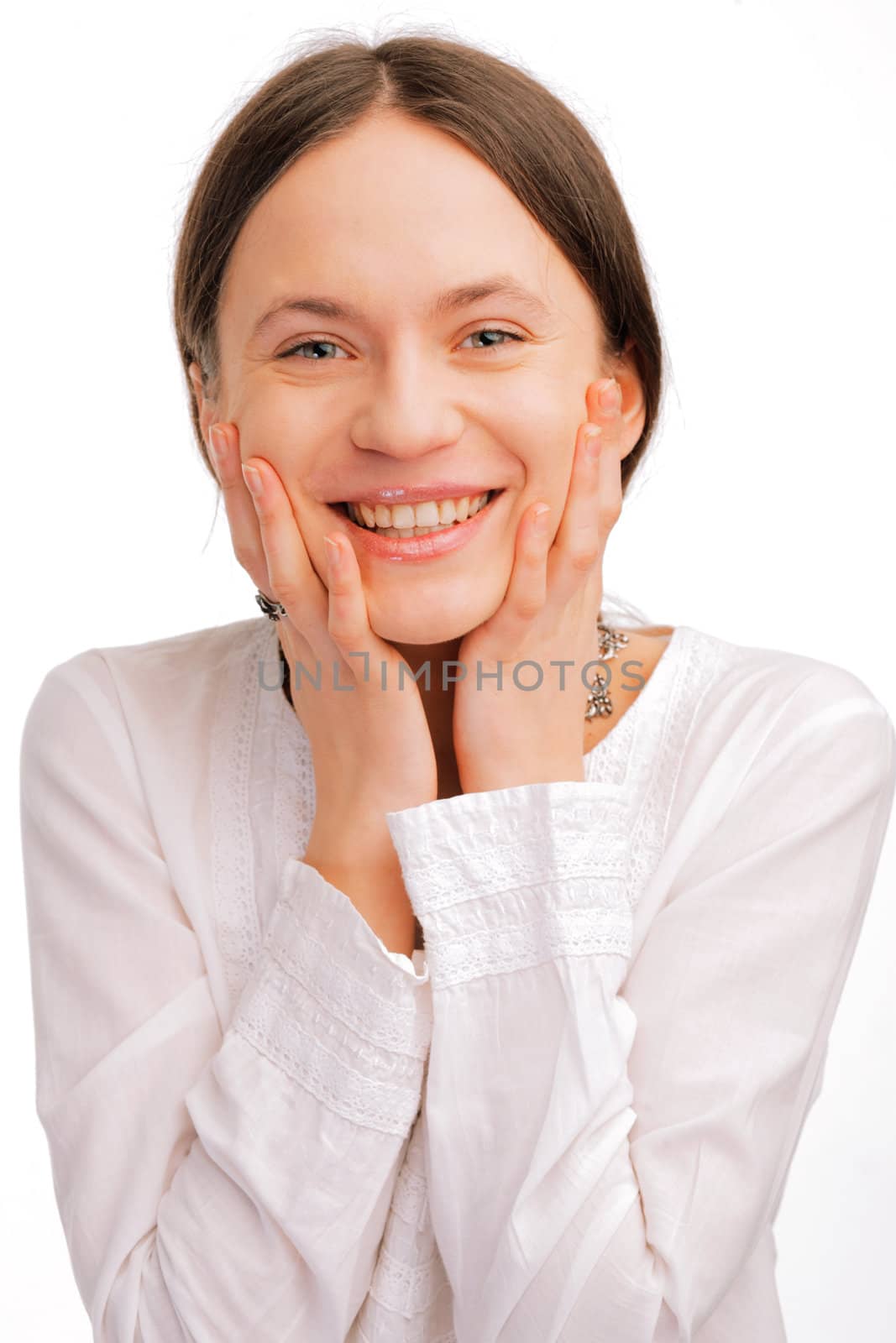 Closeup portrait of a happy surprised young woman on white background