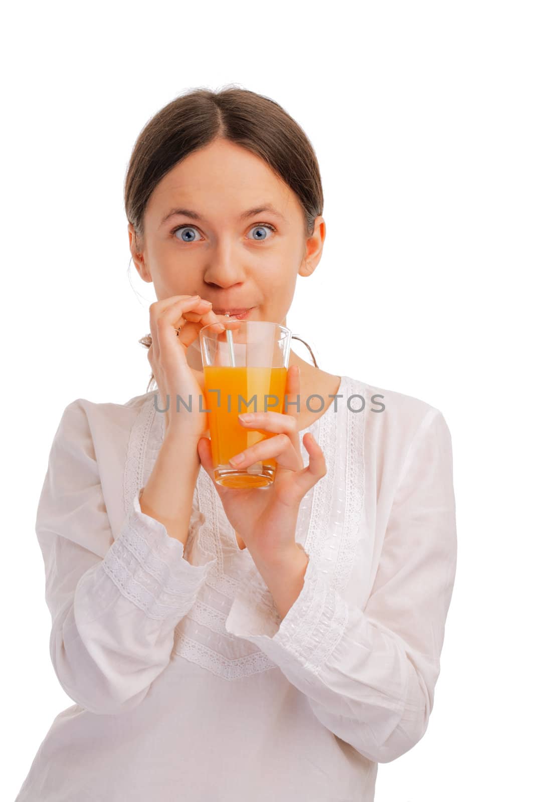 Beautiful young woman sipping juice with a straw on white background 