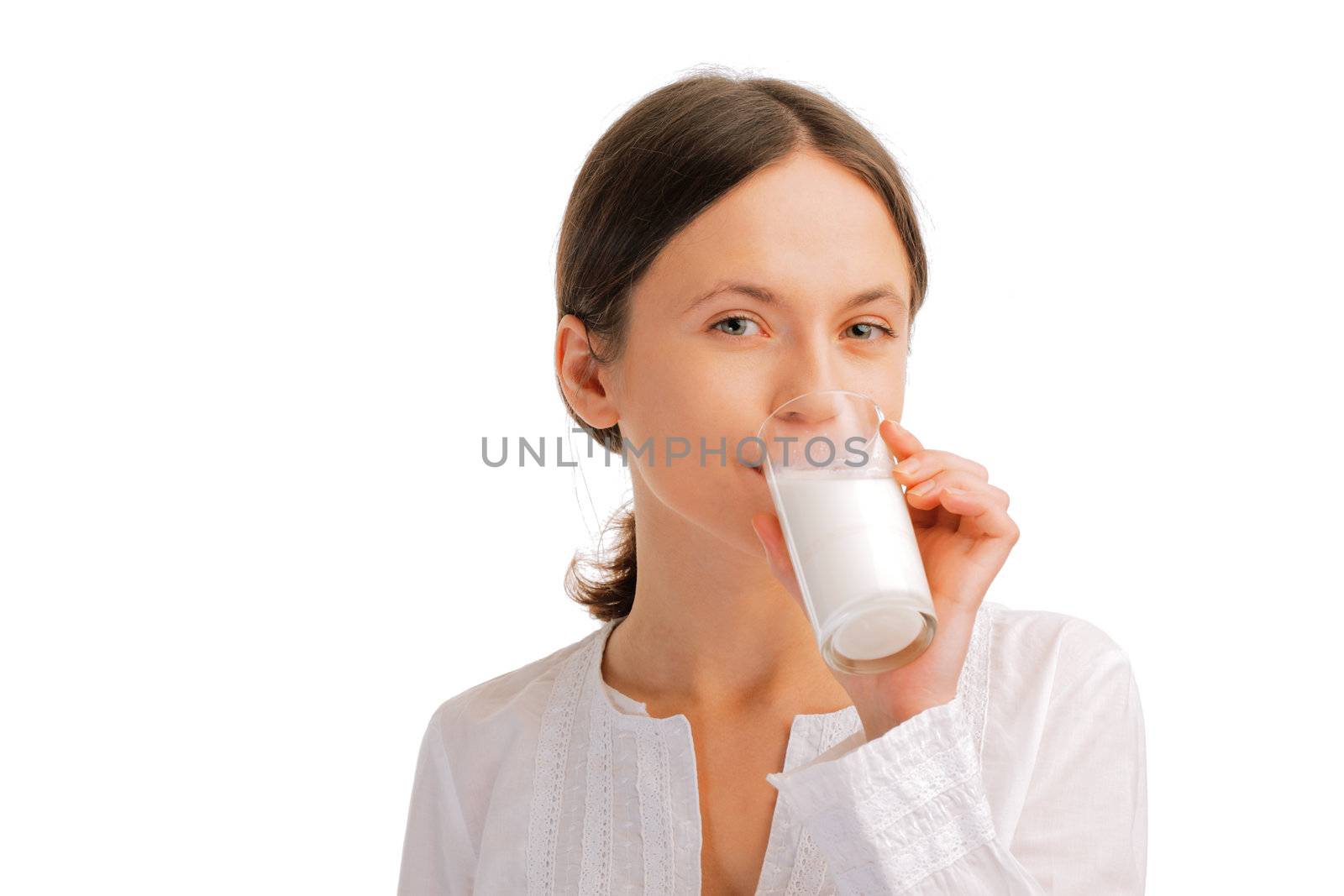 Portrait of beautiful young woman drinking milk