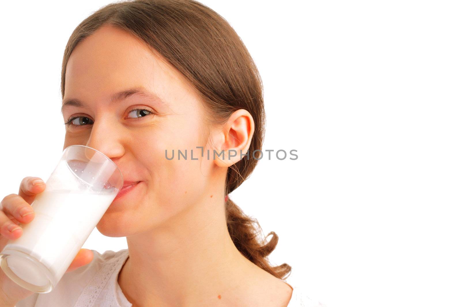 Portrait of beautiful young woman drinking milk