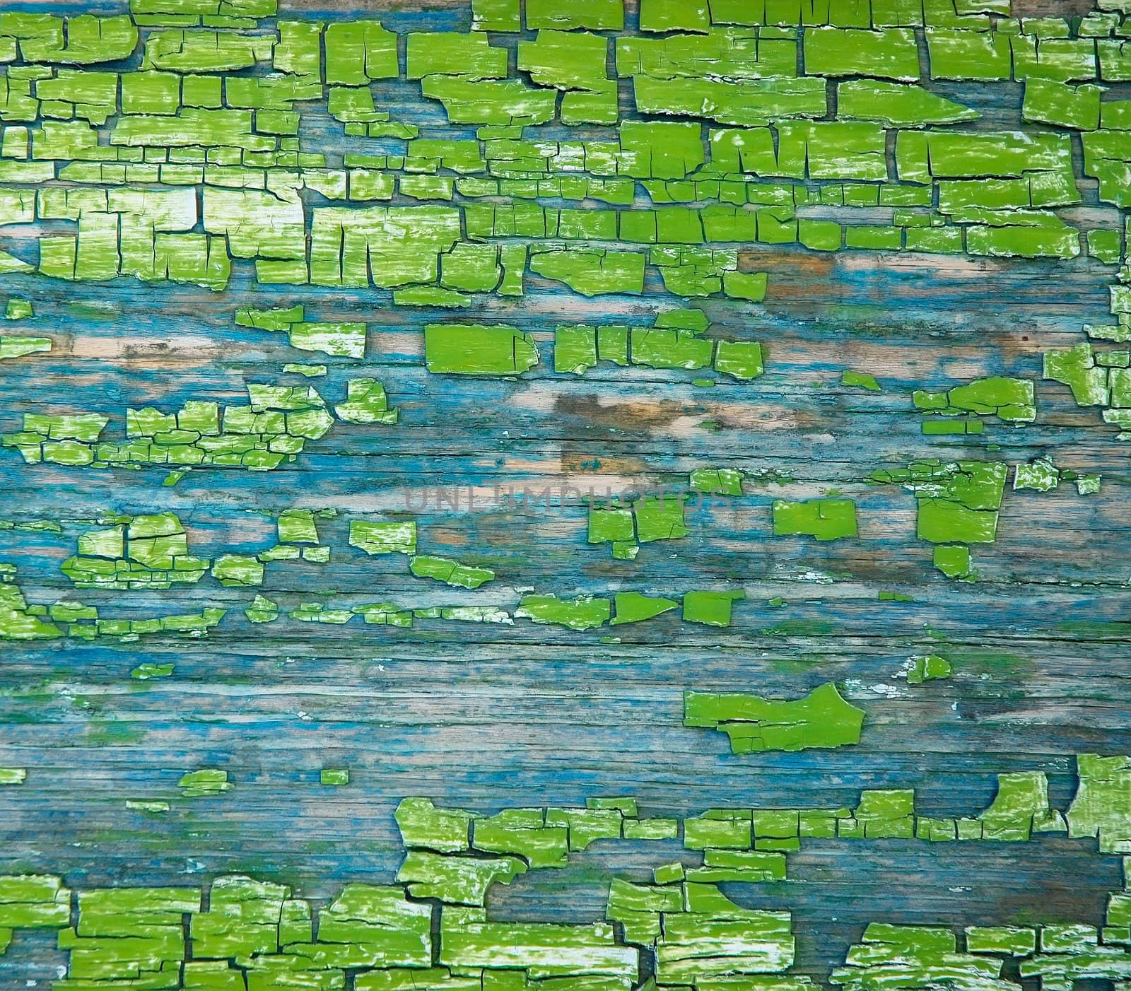 texture aging peelled green paint in rift on wooden board