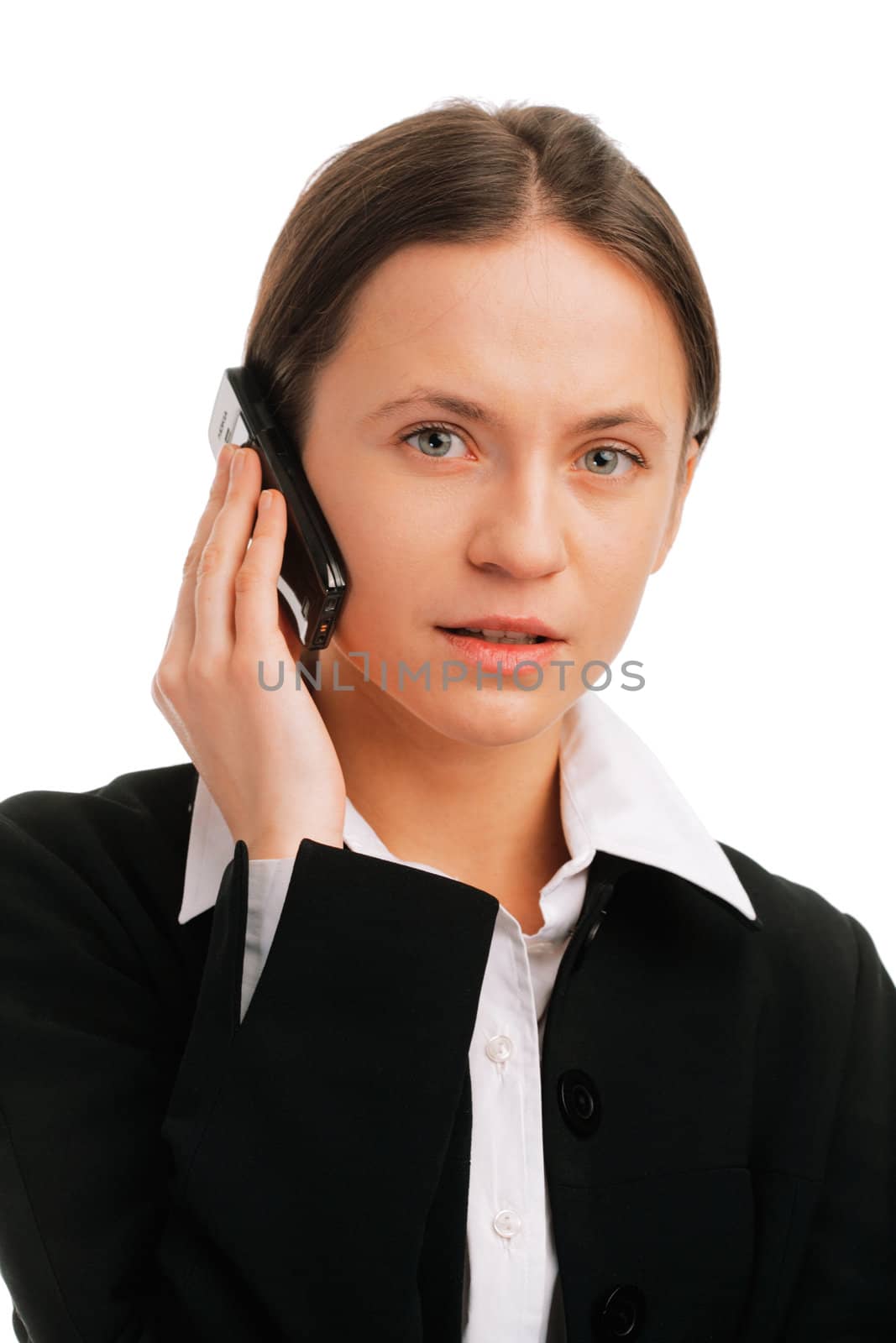 Serious businesswoman  talking on mobile phone against white background