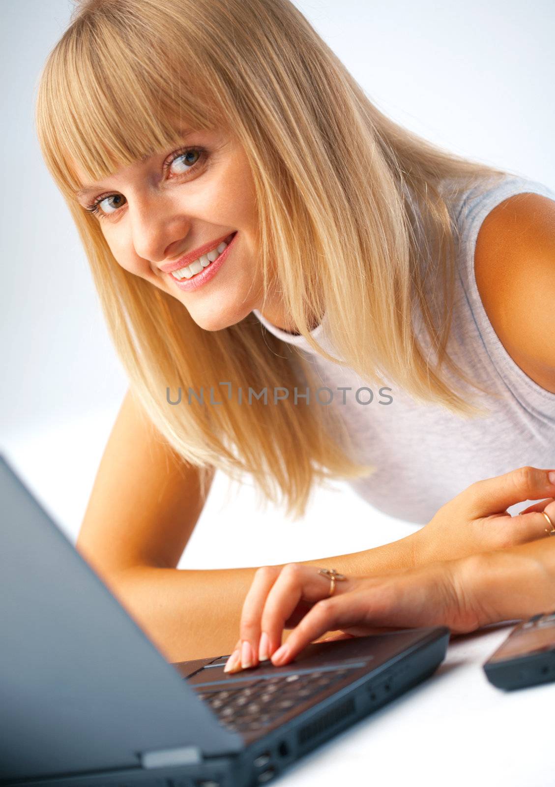 Close-up portrait of a woman with laptop