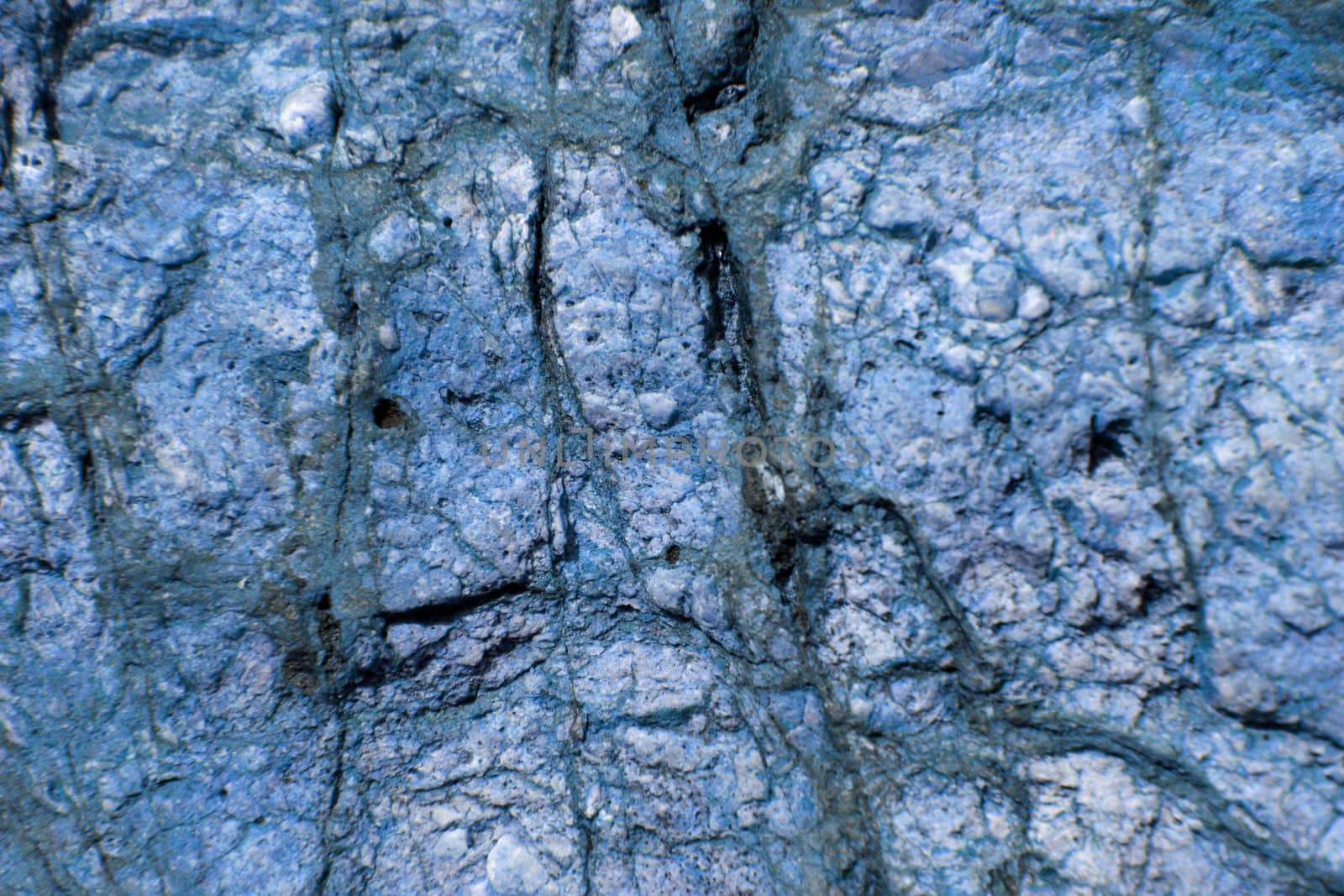texture of a blue rock, mineral background. lapiz l�zuli (gem stone). by nile