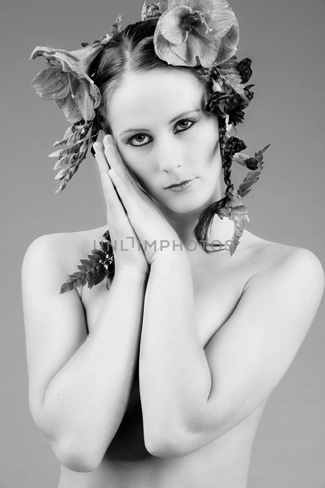 Young woman with big flowers in her hair
