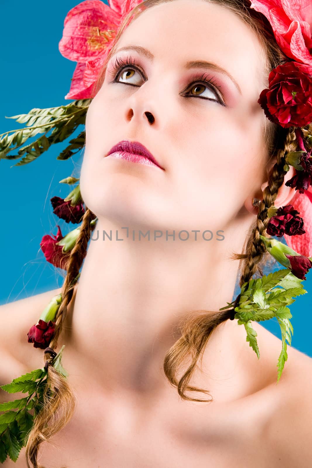 Young woman with big flowers in her hair