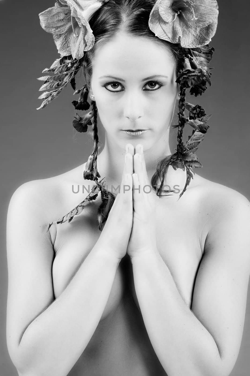 Young woman with big flowers in her hair
