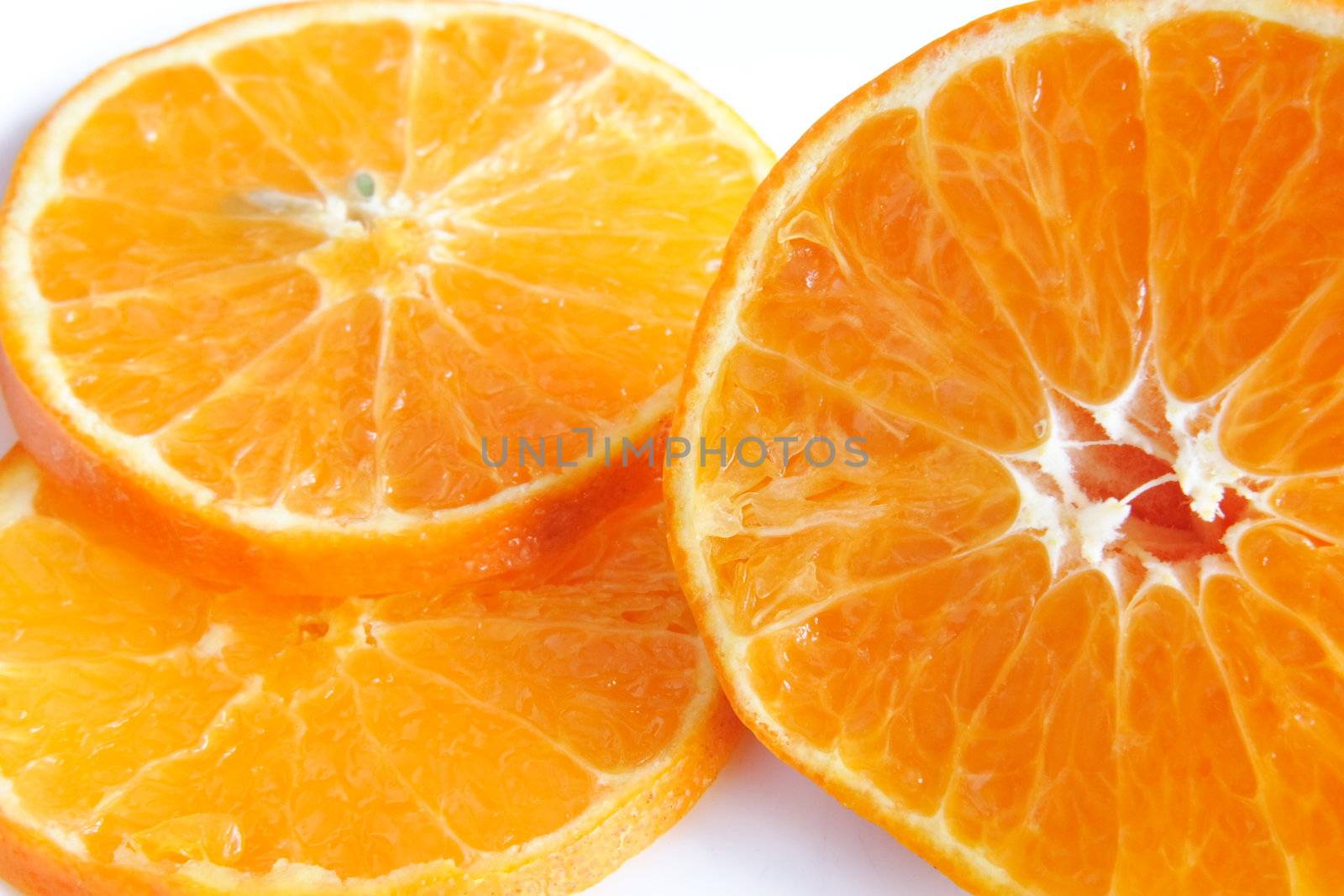 sliced orange by leafy