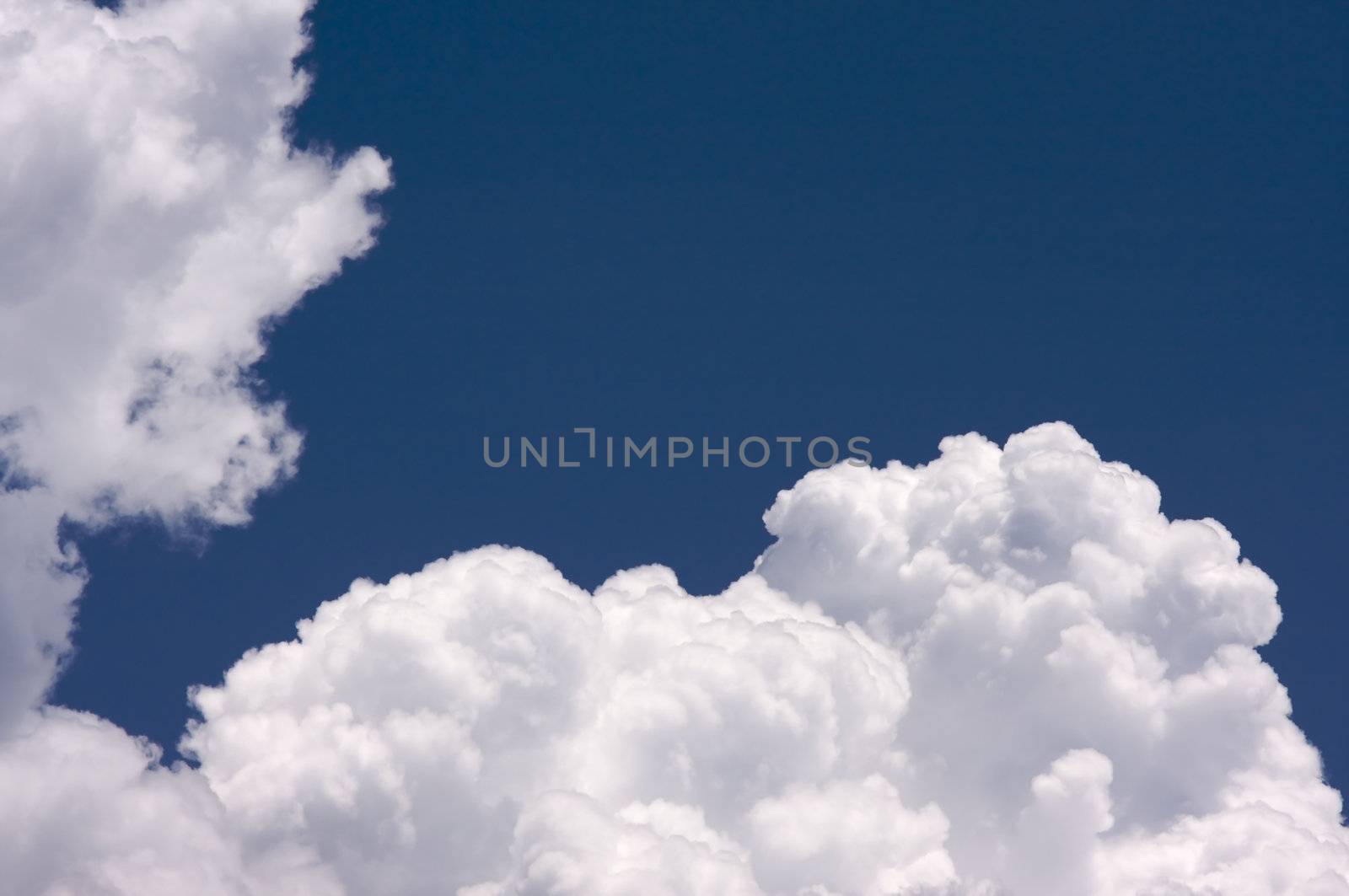 Puffy Clouds on a blue sky.