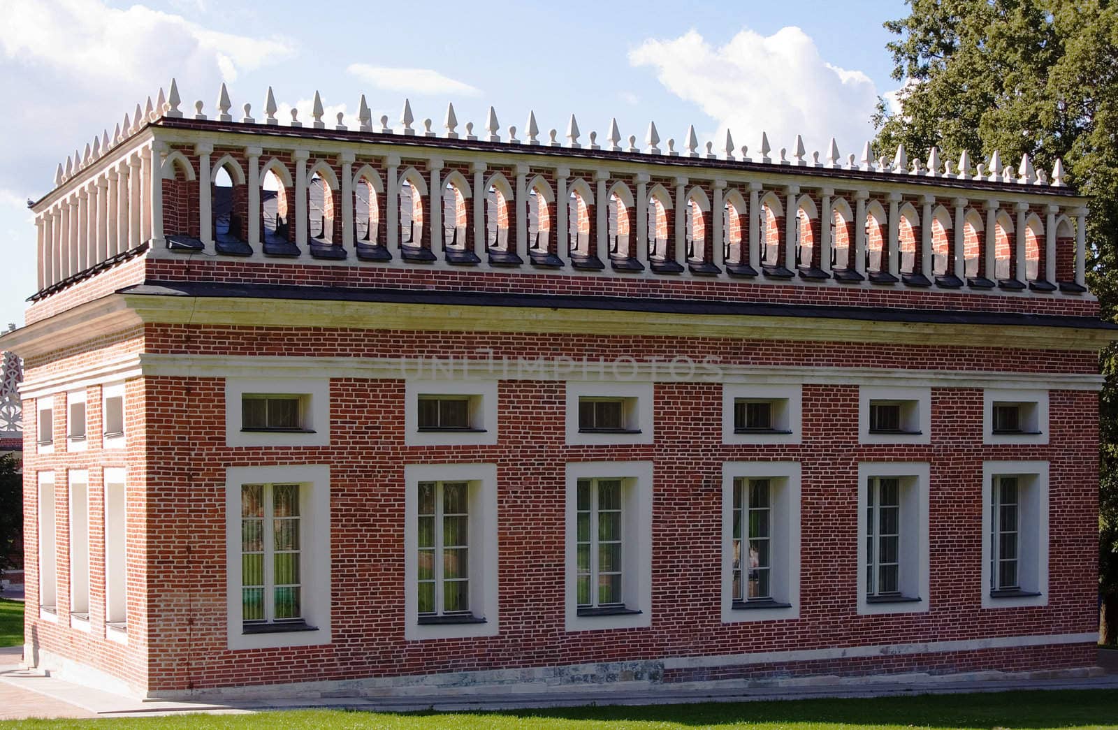 Sunlit one-storey red brick building in Tsaritsino park